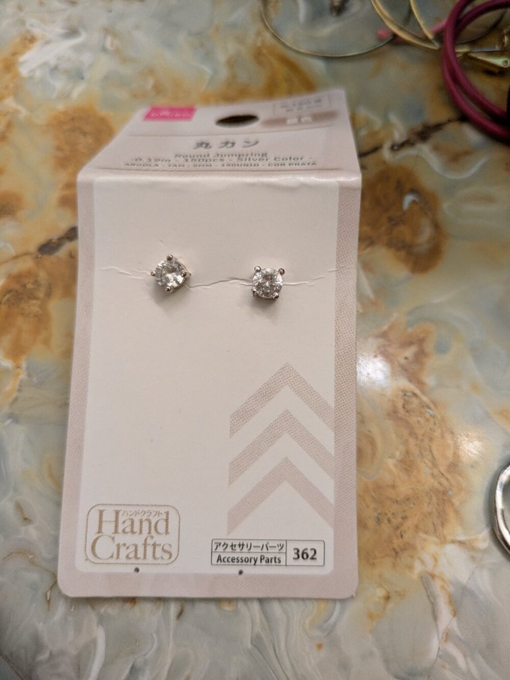 Diamond stud earrings with silver finish